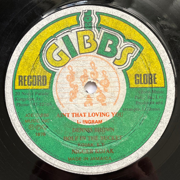 Dennis Brown / Ni**er Kojak – Ain't That Loving You / Hole In The Bucket - 1978 Jamaican Pressing VinylPursuit.com