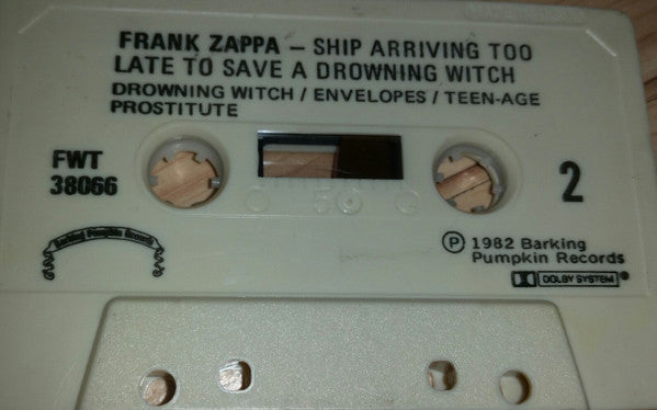 Zappa – Ship Arriving Too Late To Save A Drowning Witch - 1982 Cassette VinylPursuit.com