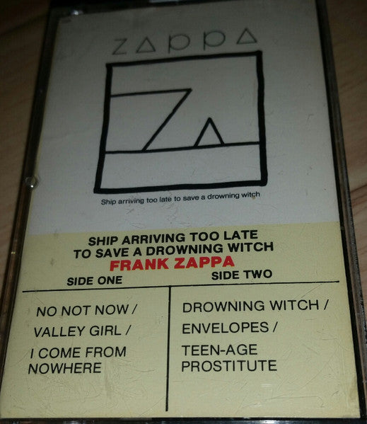 Zappa – Ship Arriving Too Late To Save A Drowning Witch - 1982 Cassette VinylPursuit.com